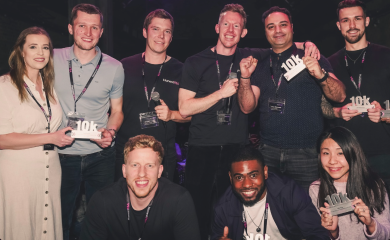 HonestBrands members celebrating awards at an event.