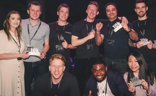 HonestBrands members celebrating awards at an event.