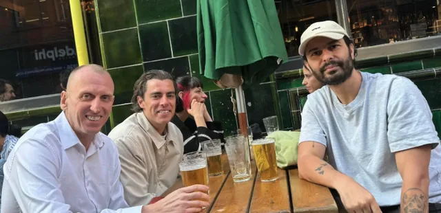 HonestBrands members sharing drinks together.